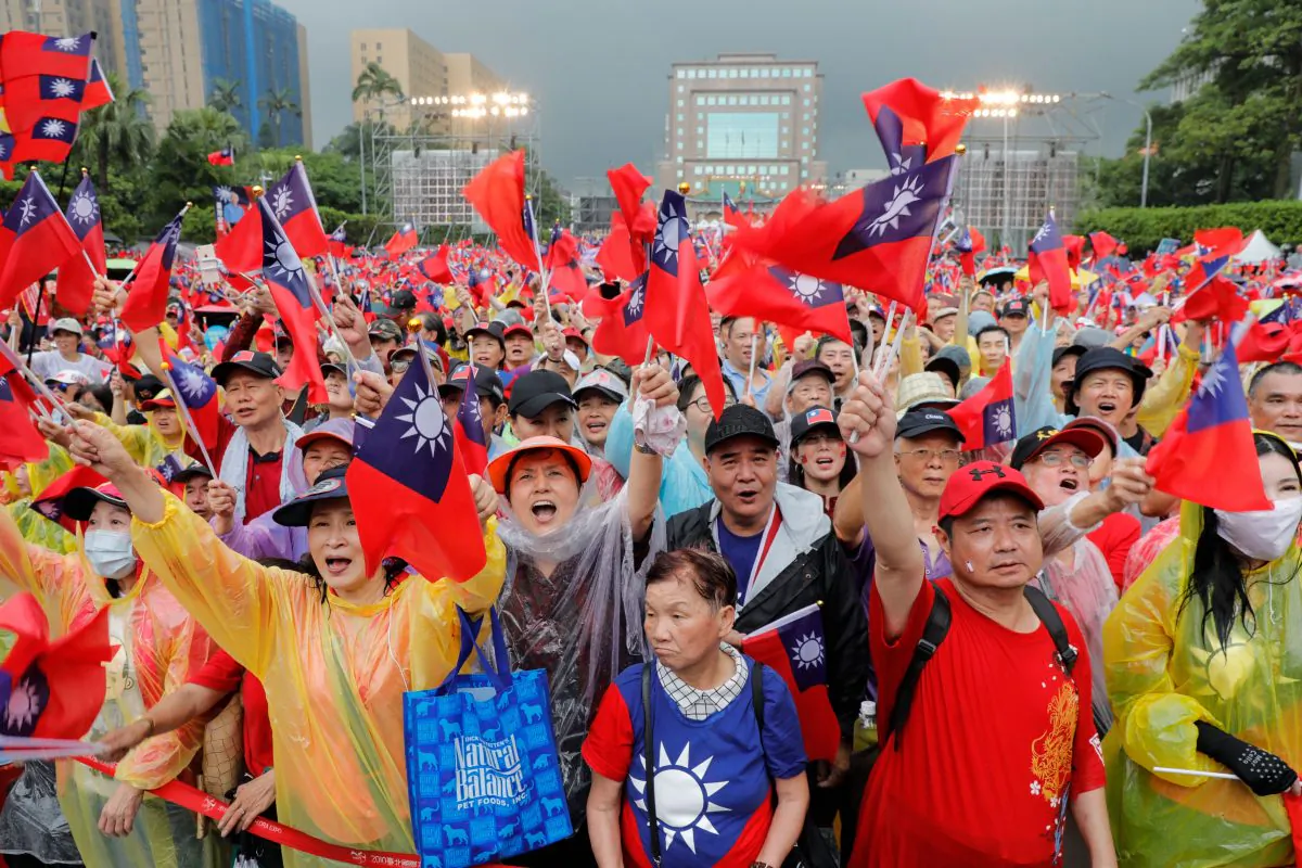Supporters of Kaohsiung city mayor Han Kuo-yu, who has joined the race to become Taiwan’s next president in 2020, wave Taiwanese flags during a campaign event in Taipei on June 1, 2019. (Daniel Shih/AFP/Getty Images)