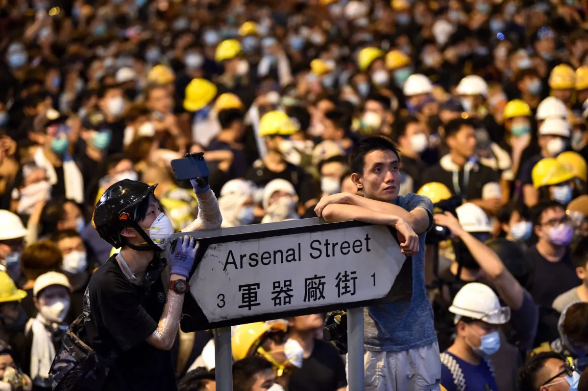 Thousands of protesters converged on Hong Kong's police headquarters on June 21, demanding the resignation of the city's pro-Beijing leader and the release of demonstrators arrested from a June 12 protest. (Hector Retamal/AFP/Getty Images)