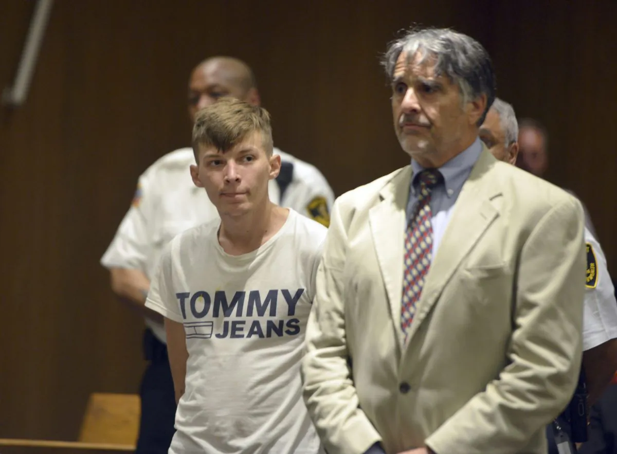 Volodymyr Zhukovskyy, 23, of West Springfield, stands with his attorney Donald Frank during his arraignment in Hampton District Court in Springfield, Mass., on June 24, 2019. (Don Treeger/The Republican via AP)