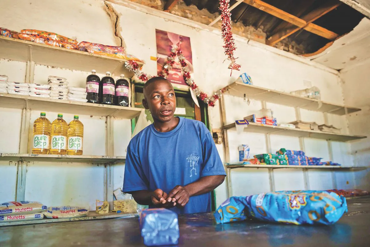 Solomon Chakauya, who says people have no money to buy the things they would wish to buy, waits for customers in his grocery store in Chinamhora, Zimbabwe, on Dec. 10, 2018. (JEKESAI NJIKIZANA/AFP/Getty Images)