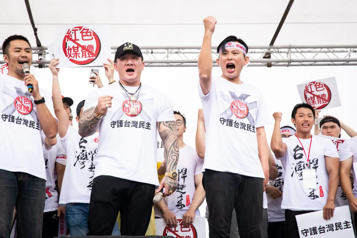 The two organizers, Holger Chen Huang (L) and Kuo-chang (R) at the mass rally in protest of the pro-Beijing media in Taipei, Taiwan, on June 23, 2019. (Chen Bozhou/The Epoch Times) 