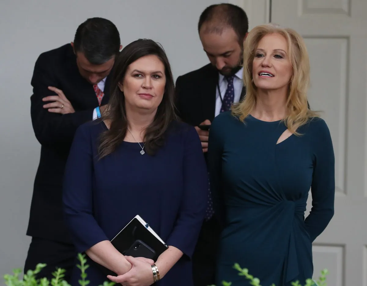 White House press secretary Sarah Sanders (L) and White House counselor Kellyanne Conway (R) listen to President Donald Trump speak in the Rose Garden at the White House on May 22, 2019.  Mark Wilson/Getty Images