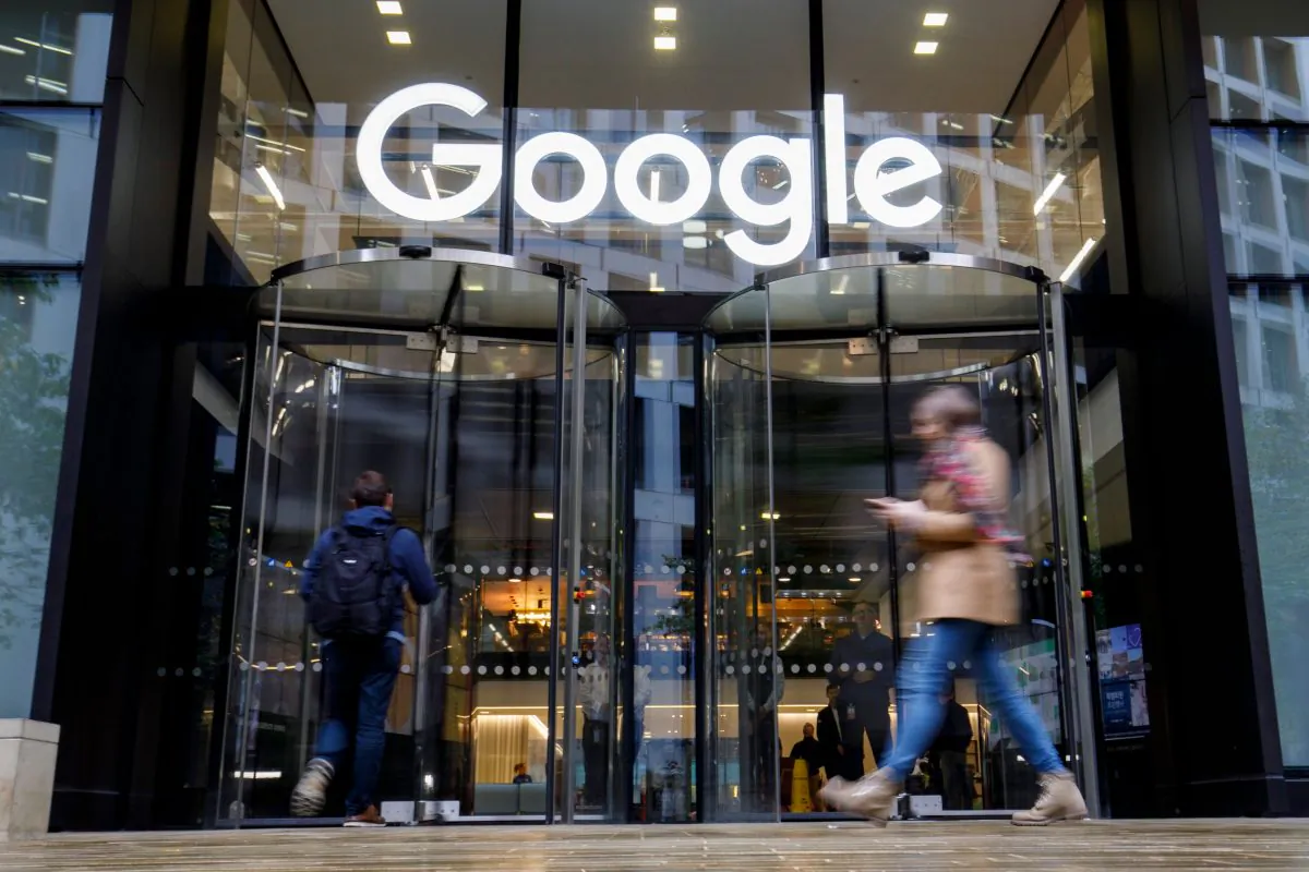 People walk past Google's UK headquarters in London on Nov. 1, 2018. (Tolga Akmen/AFP/Getty Images)