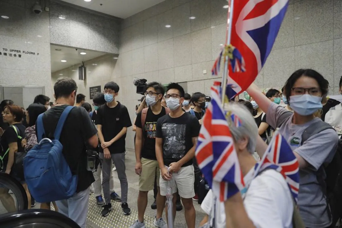 Protesters carry British flags as they block the lobby of the Hong Kong Revenue Tower in Hong Kong on June 24, 2019. Hong Kong has been rocked by major protests for the past two weeks over legislative proposals that many view as eroding the territory's judicial independence and, more broadly, as a sign of the Chinese regime's efforts to chip away at the city's freedoms. (Kin Cheung/AP)