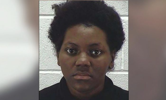 A 23-year-old Illinois woman is charged with two counts of felony battery after allegedly slamming her 6-month-old son into furniture, police said. (Aurora Police Department)