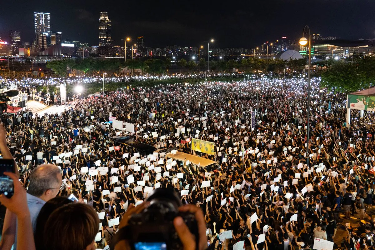 Thousands of protesters take part in a rally against a controversial extradition bill ahead of the G-20 summit, at Edinburgh Place in Central district, Hong Kong, on June 26, 2019. (Li Yi/The Epoch Times)