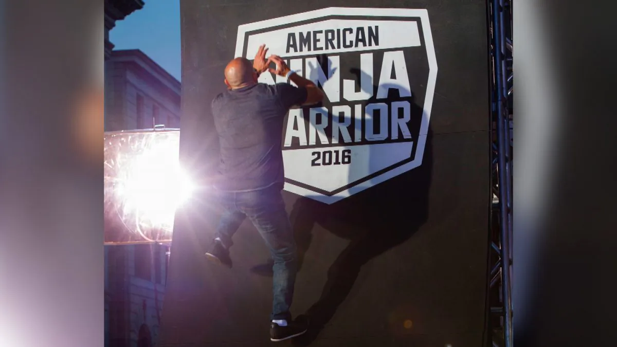 A competitor climbs the last wall of the challenge at the "American Ninja Warrior" screening and course demonstration In celebration of the show's first Emmy Award nomination, at Universal Studio, in Universal City, Calif., on Aug. 24, 2016. (Valerie Macon/AFP/File photo via Getty Images)