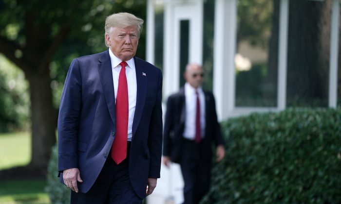 U.S. President Donald Trump walks to reporters before leaving the White House for the G-20 summit in Washington, on June 26, 2019. (Chip Somodevilla/Getty Images)