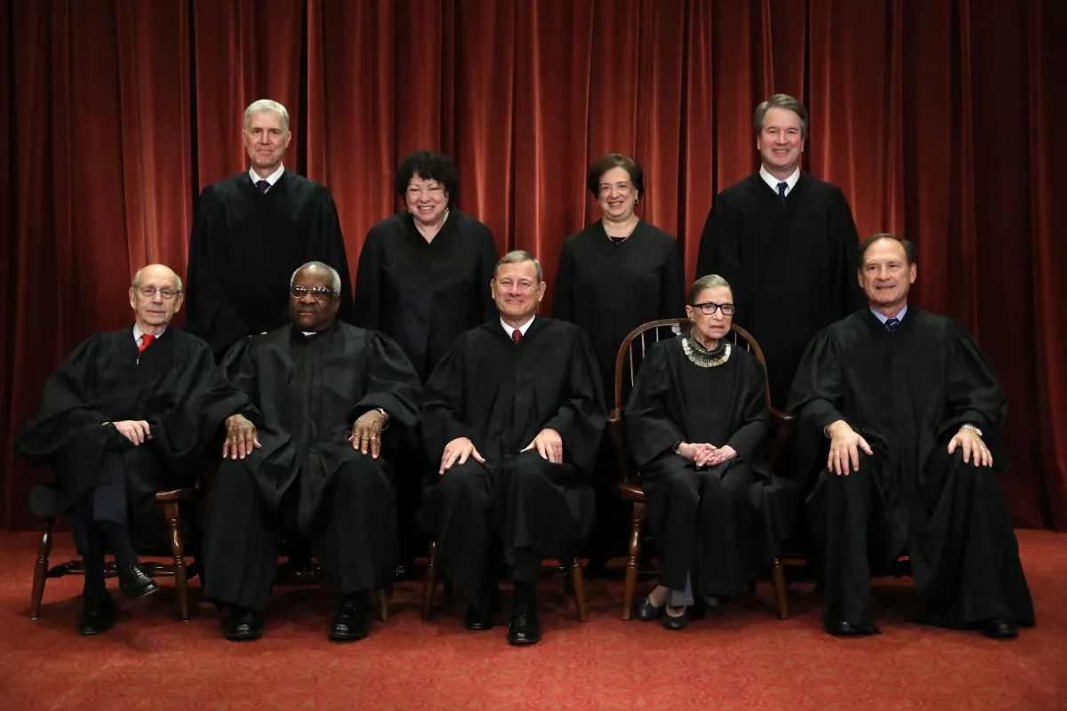 (Front L–R) Supreme Court justices Stephen Breyer, Clarence Thomas, John Roberts, Ruth Bader Ginsburg, Samuel Alito, (Back L–R) Neil Gorsuch, Sonia Sotomayor, Elena Kagan, and Brett Kavanaugh at the Supreme Court building on Nov. 30, 2018. (Chip Somodevilla/Getty Images)
