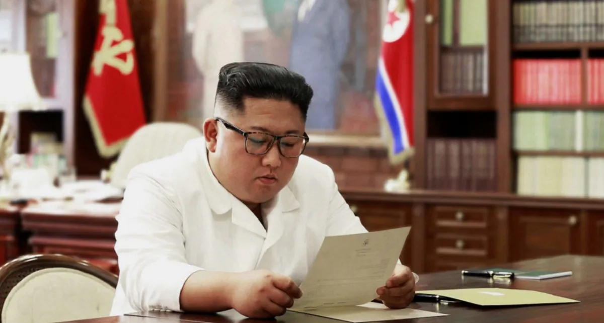 Korean leader Kim Jong Un reads a letter from President Donald Trump, on June 23,2019. (Korean Central News Agency/Korea News Service via AP, File)