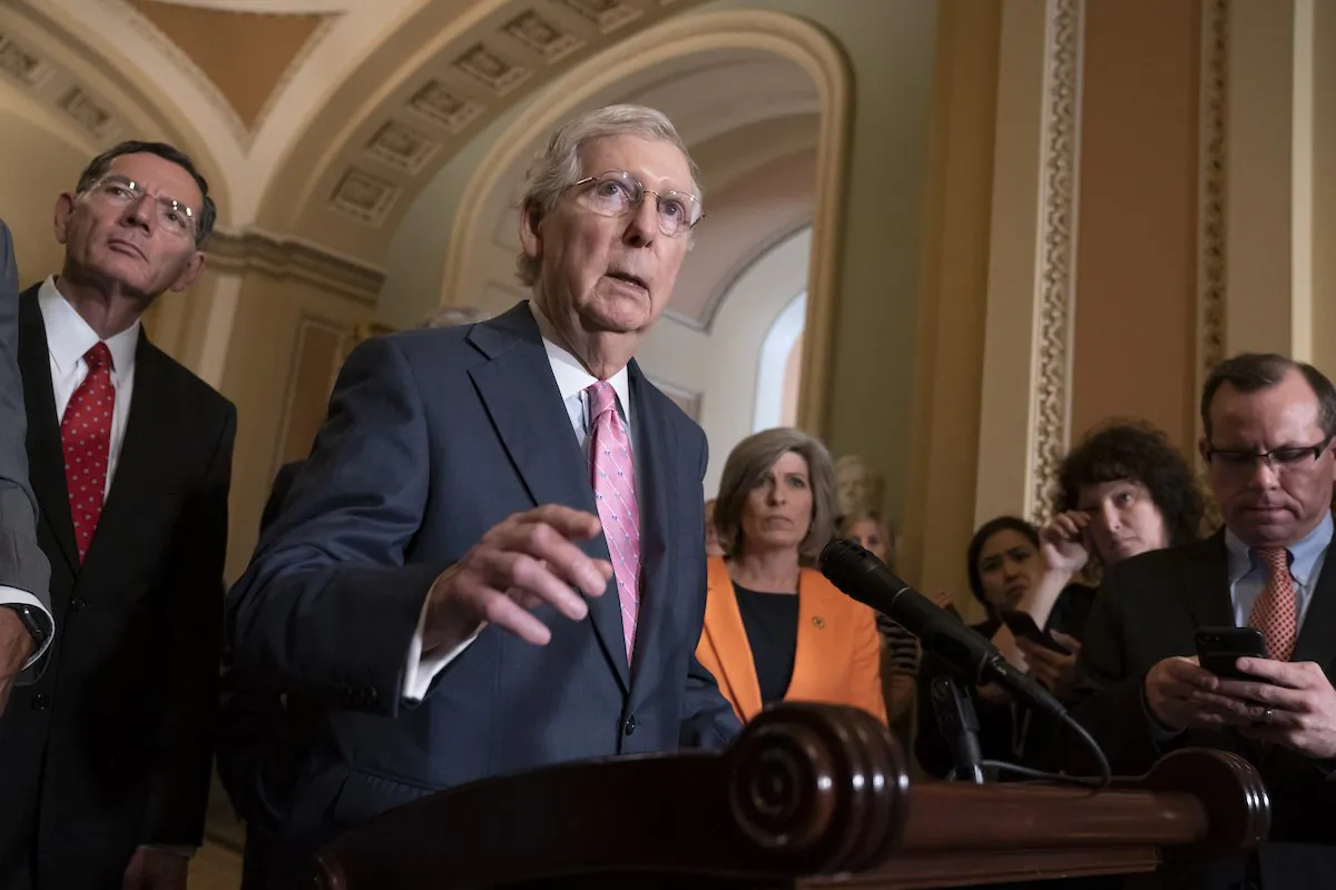 Senate Majority Leader Mitch McConnell (R-Ky.) joined at left by Sen. John Barrasso (R-Wyo.) and Sen. Joni Ernst (R-Iowa) right, speaks to reporters following the Republican Conference luncheon, at the Capitol in Washington on June 25, 2019. (AP Photo/J. Scott Applewhite)