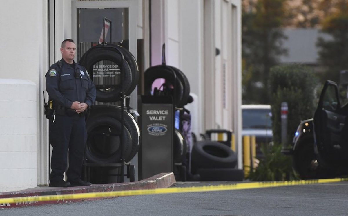 Police investigate at the scene of a shooting