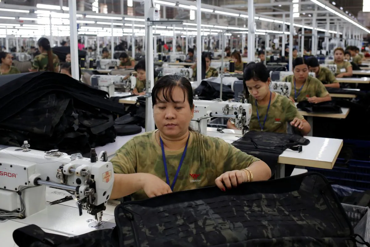 Workers assemble products at a factory owned by Yakeda Outdoor Travel Products Co in Yangon, Burma on June 11, 2019. (Ann Wang/Reuters)