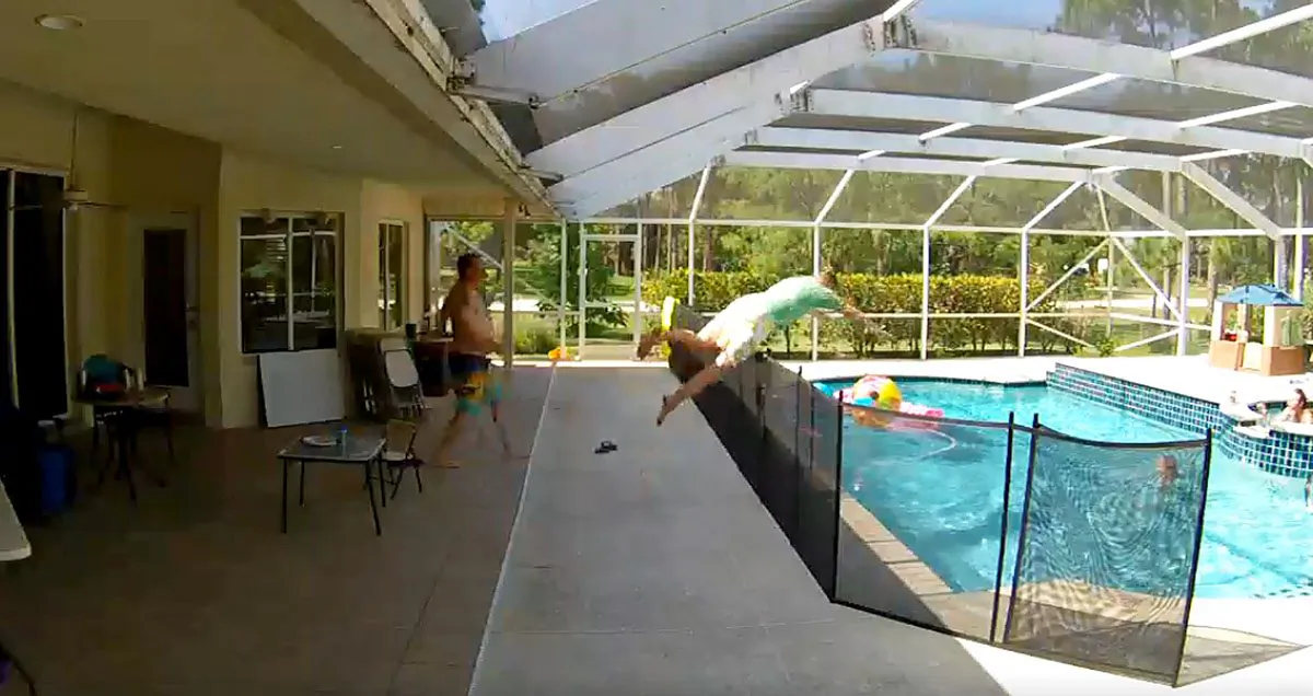 Father Albert Passavanti jumps into the pool to rescue toddler Rocco who fell into the water in West Palm Beach, Fla., on June 23, 2019. (Albert Passavanti/Facebook)