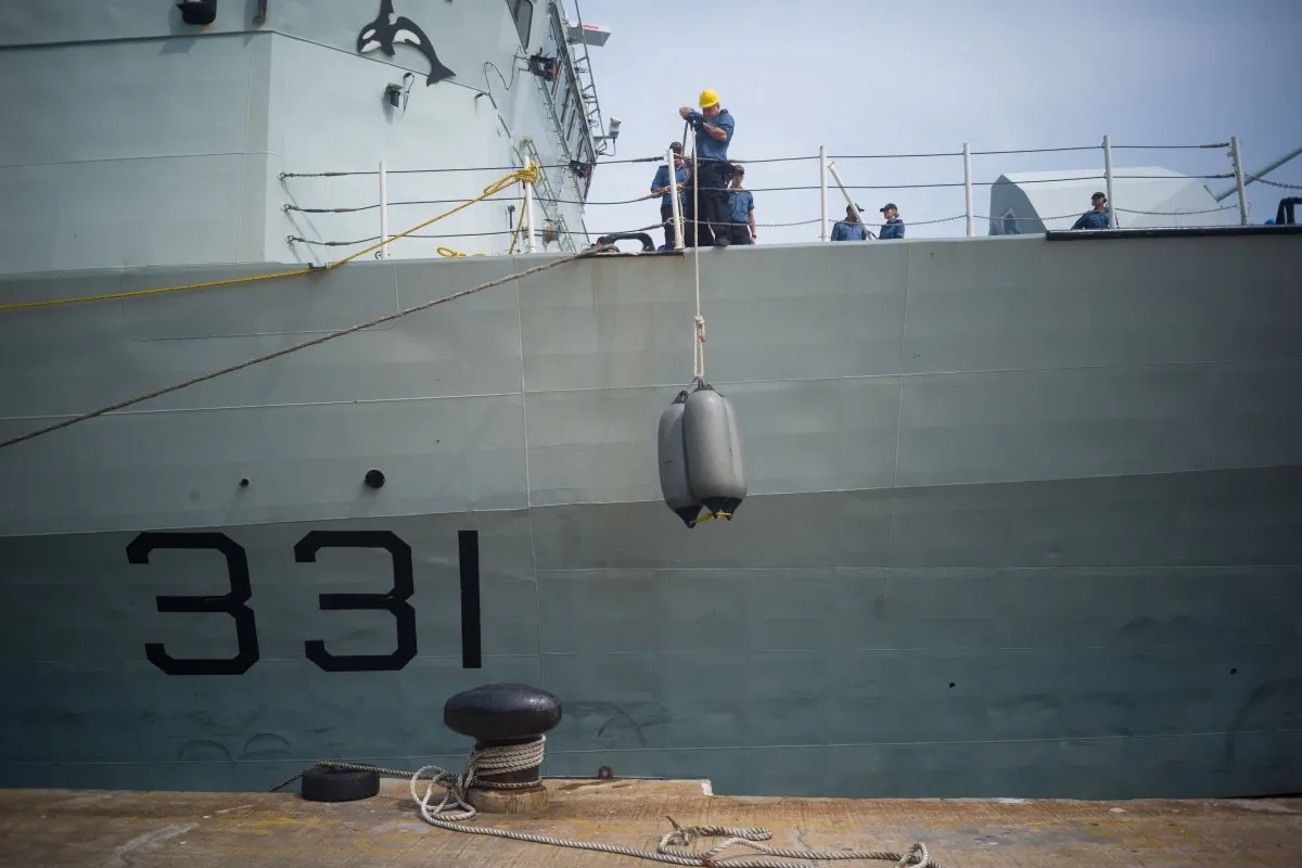 Crew members of Her Majestys Canadian Ship (HMCS) Vancouver make preparations shortly after the ship's arrival in Hong Kong's Victoria Harbour on May 3, 2018. (Anthony Wallace/AFP/Getty Images)