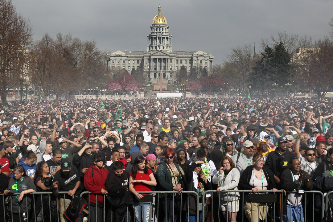 Marijuana smoke rises from a smoking crowd April 20, 2010 at a pro-pot "4/20" celebration in front of the state capitol building in Denver, Col. (John Moore/Getty Images)