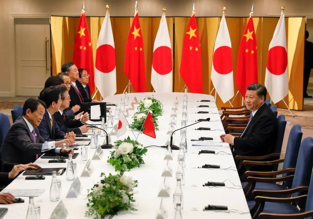 Japanese Prime Minister Shinzo Abe (2nd L) and Chinese leader Xi Jinping (R) attend their talks in Osaka, on June 27, 2019, ahead of the G20 Osaka Summit. (Kimimasa Mayama/AFP/Getty Images)