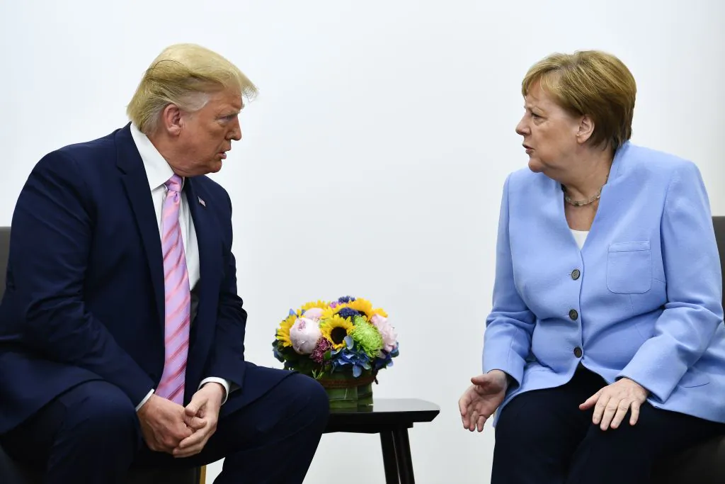 US President Donald Trump (L) attends a meeting with Germany's Chancellor Angela Merkel during the G20 Osaka Summit in Osaka on June 28, 2019. (BRENDAN SMIALOWSKI/AFP/Getty Images)