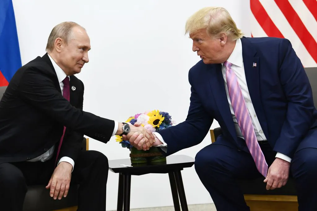 US President Donald Trump (R) attends a meeting with Russia's President Vladimir Putin during the G20 summit in Osaka on June 28, 2019. (BRENDAN SMIALOWSKI/AFP/Getty Images)