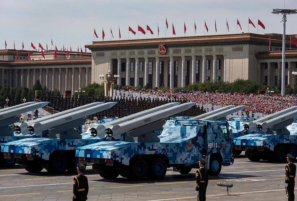 Chinese missiles are seen on trucks as they drive next to Tiananmen Square and the Great Hall of the People during a military parade in Beijing on Sept. 3, 2015. (Kevin Frayer/Getty Images)