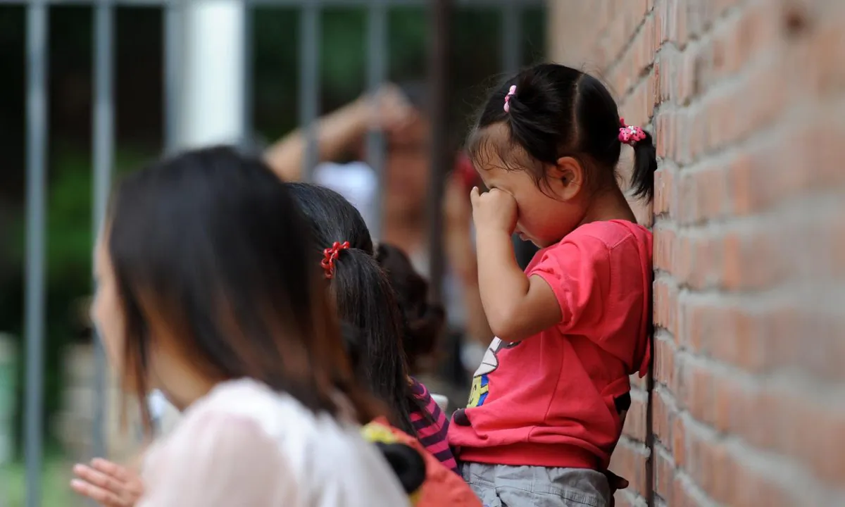 A girl outside a school.(STR/AFP/Getty Images)
