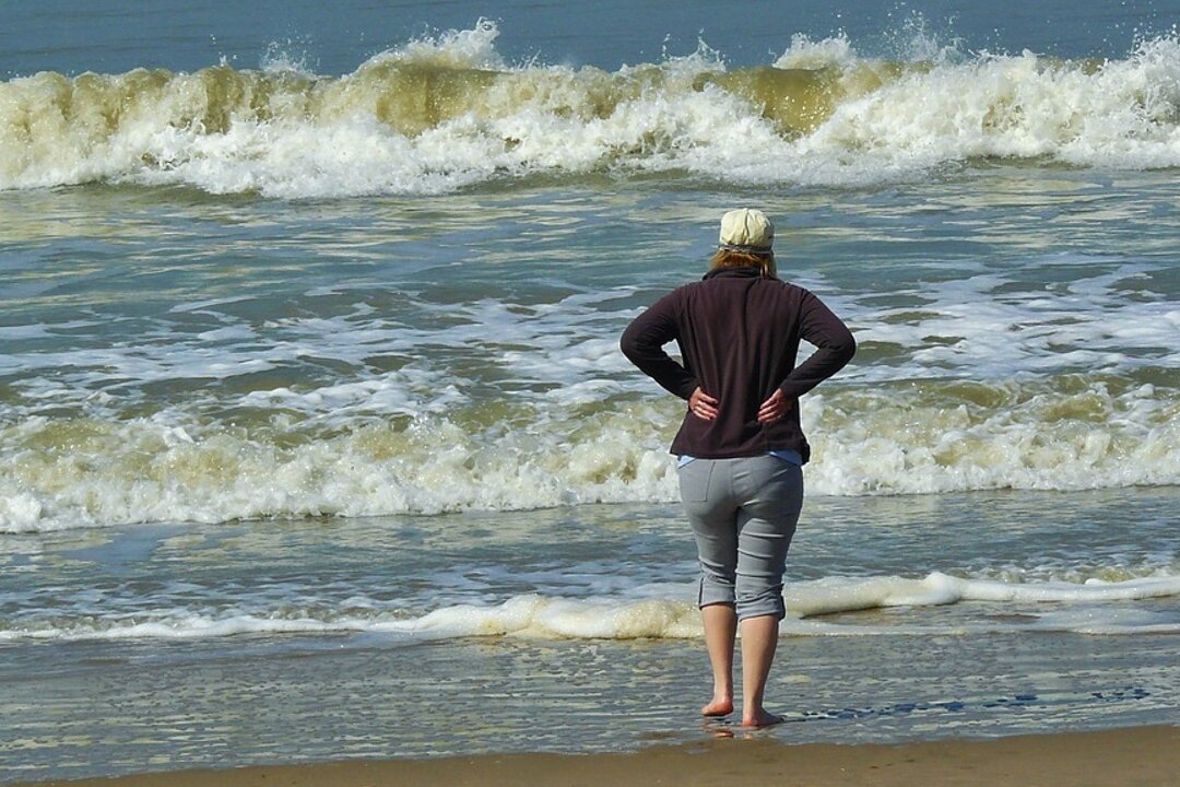Stock image of a woman on beach. (Cocoparisienne/Pixabay)