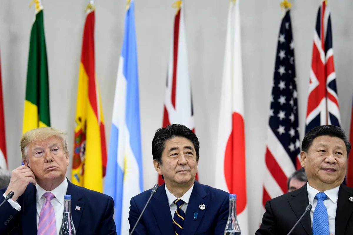 L-R) US President Donald Trump, Japan's Prime Minister Shinzo Abe and China's President Xi Jinping attend a meeting at the G20 Summit in Osaka on June 28, 2019. (BRENDAN SMIALOWSKI/AFP/Getty Images)