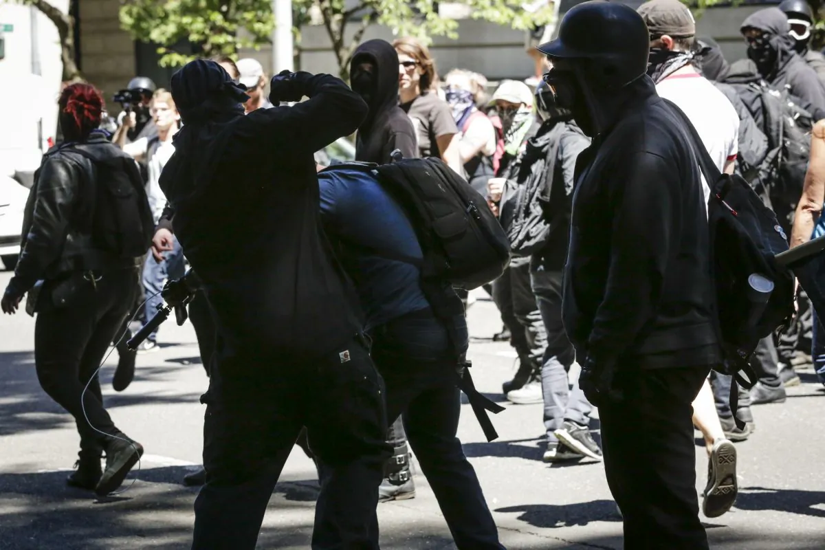 Unidentified Rose City Antifa members beat up Andy Ngo, a Portland-based journalist, on June 29, 2019 in Portland, Oregon. (Moriah Ratner/Getty Images)
