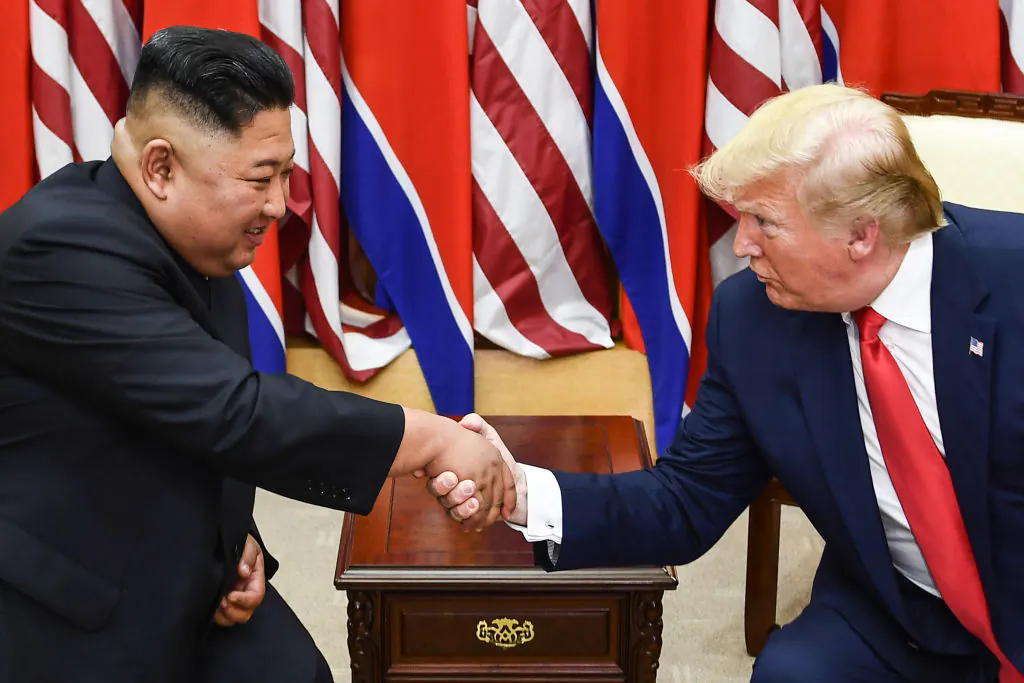 North Korea's leader Kim Jong Un (L) and US President Donald Trump shake hands during a meeting on the south side of the Military Demarcation Line that divides North and South Korea, in the Joint Security Area (JSA) of Panmunjom in the Demilitarized zone (DMZ) on June 30, 2019. (Brendan Smialowski/AFP/Getty Images)