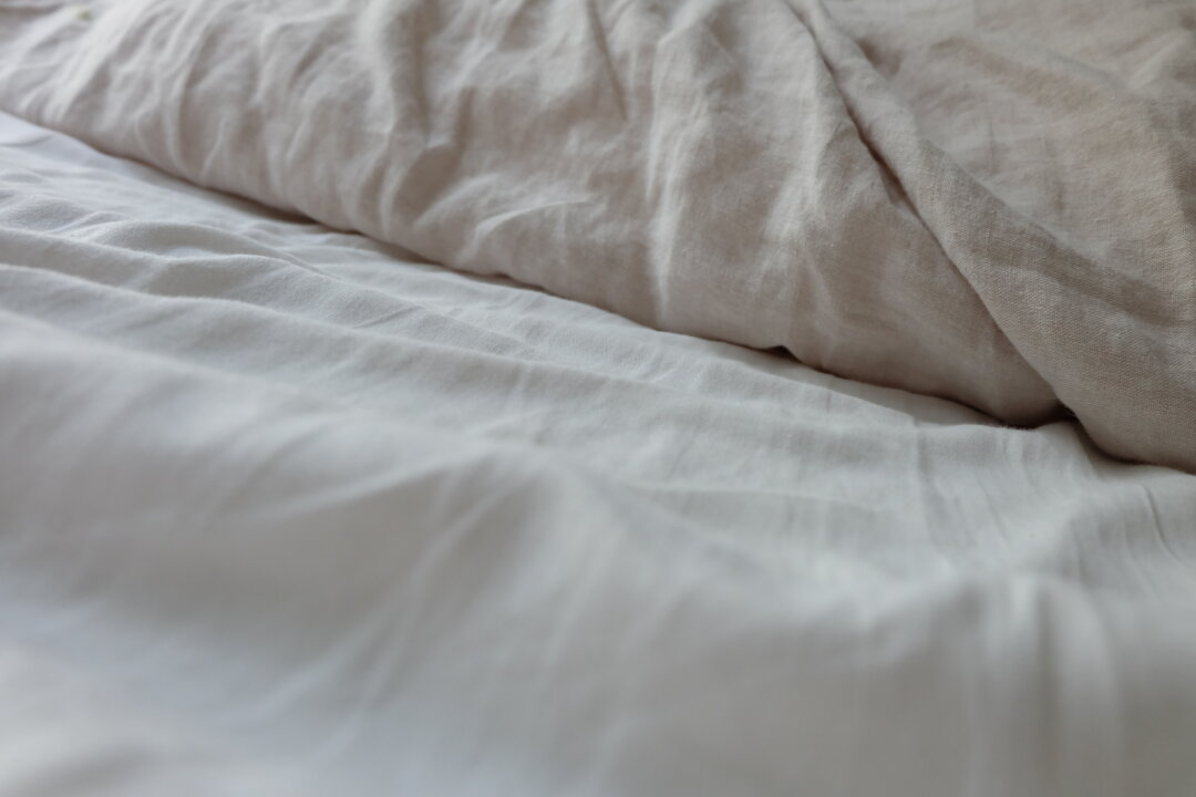 Cheap sheets are so cheap if you have to keep replacing them. Linen is almost impossible to beat if you are looking for fabric that can keep you comfortable and last a lifetime.   (HanneLink/Shutterstock)