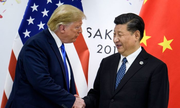 Chinese leader Xi Jinping shakes hands with U.S. President Donald Trump before a bilateral meeting on the sidelines of the G20 Summit in Osaka on June 29, 2019. (Brendan Smialowski/AFP/Getty Images)