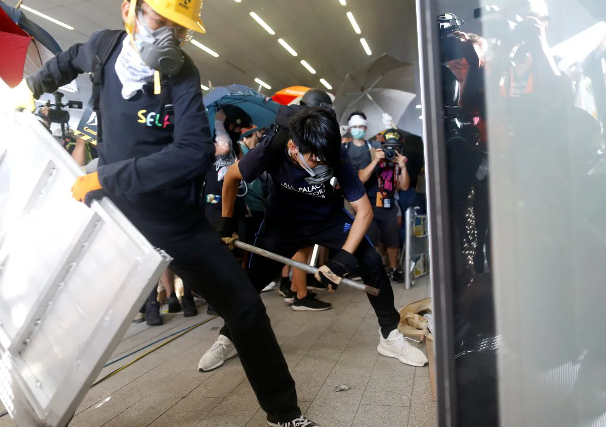Protesters break into the Legislative Council building during the anniversary of Hong Kong's handover to China in Hong Kong, on July 1, 2019. (Thomas Peter/Reuters)