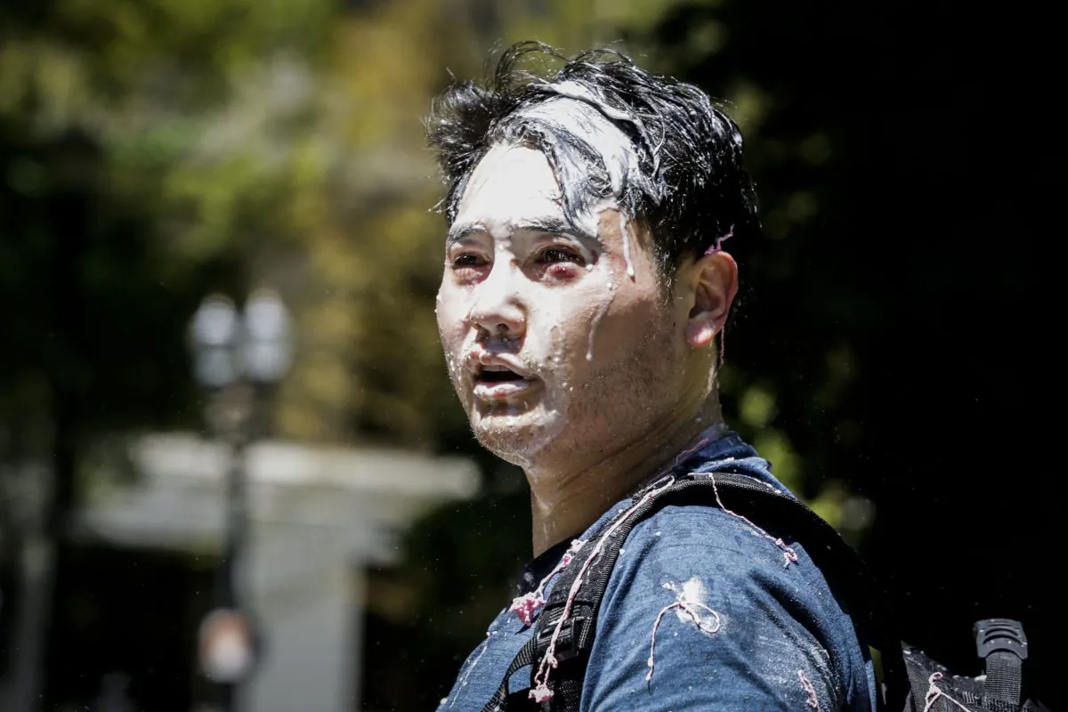 Andy Ngo, a Portland-based journalist, is seen covered in unknown substance after unidentified Rose City Antifa members attacked him in Portland, Oregon on June 29, 2019. (Moriah Ratner/Getty Images)