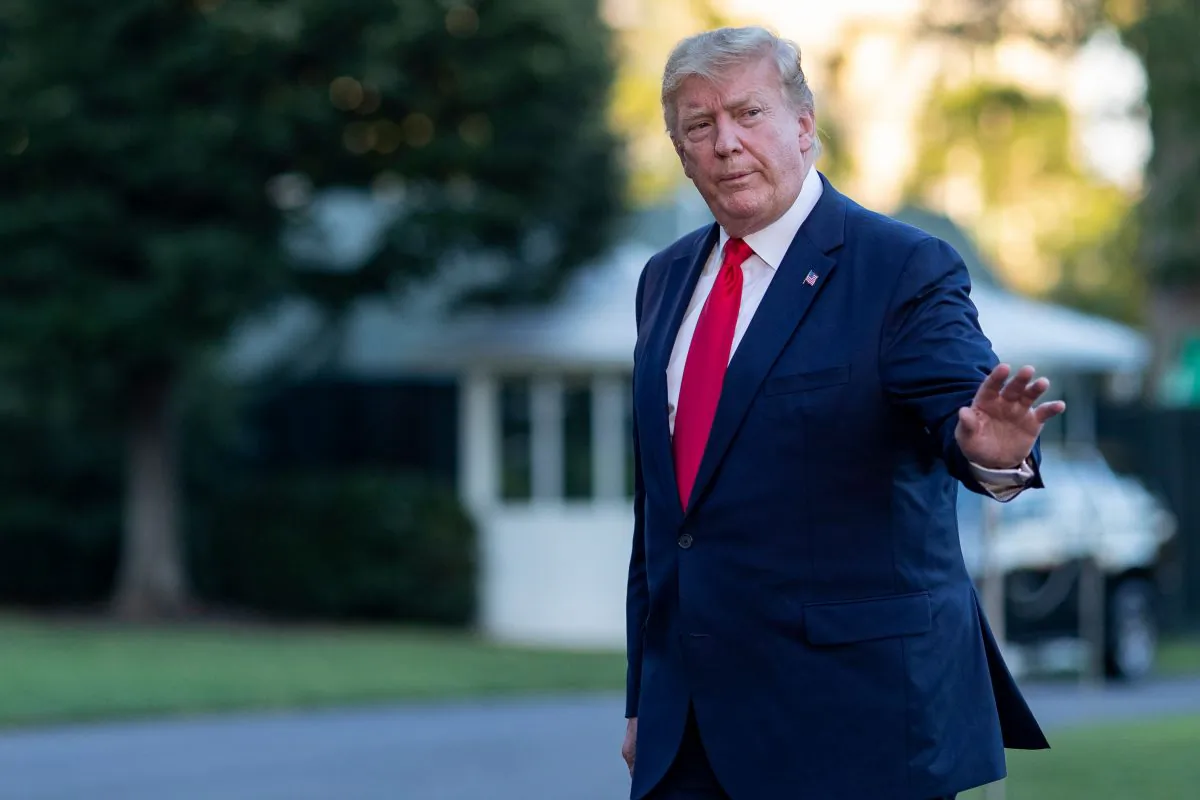 President Donald Trump waves as he arrives at the White House after a trip to Asia in Washington on June 30, 2019. (Alex Edelman/AFP/Getty Images)
