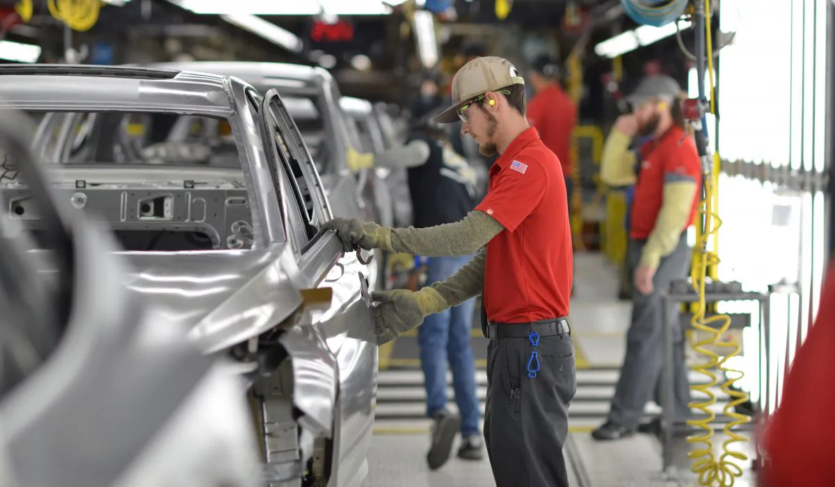 A line worker checks frames for imperfections at Nissan Motor Co's automobile manufacturing plant in Smyrna, Tenn., on Aug. 23, 2018. (Reuters/William DeShazer/File Photo)
