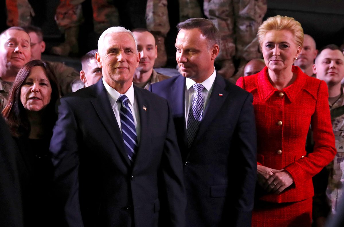 U.S. Vice President Mike Pence, his wife Karen, Polish President Andrzej Duda and his wife Agata Kornhauser-Duda are seen after Pence's arrival at the airport in Warsaw