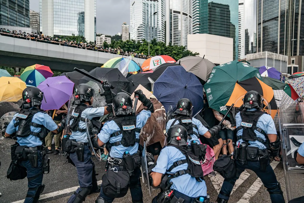 Police officers use baton to disperse anti-extradition protesters during a clash outside the Legislative Council Complex on July 1, 2019 in Hong Kong, China. (Anthony Kwan/Getty Images)