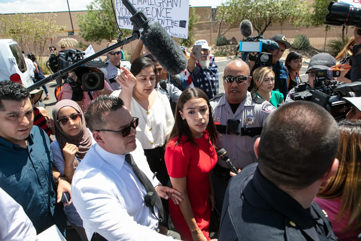 Rep. Alexandria Ocasio-Cortez (D-NY) is swarmed by  the media after touring the Clint, TX Border Patrol Facility housing children in Clint, Texas, on July 1, 2019. (Christ Chavez/Getty Images)