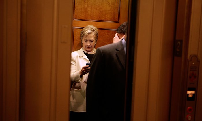 Secretary of State-designate and U.S. Sen. Hillary Clinton (D-N.Y.) looks at her BlackBerry while on an elevator at the U.S. Capitol in Washington on Jan. 7, 2009. (Chip Somodevilla/Getty Images)