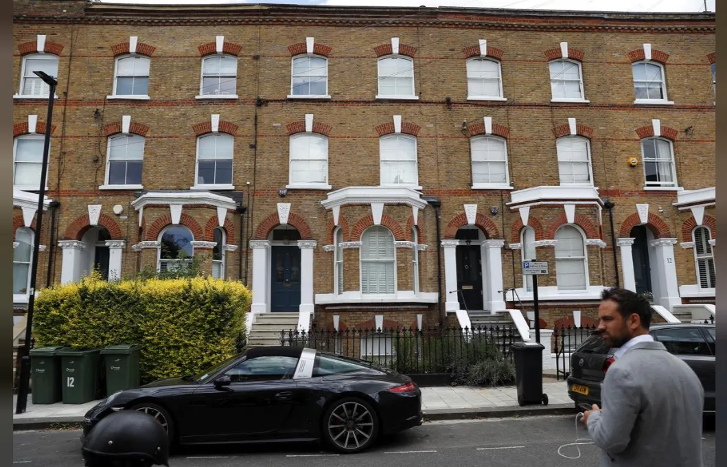 General view outside a house where the body of a suspected stowaway fell into the back garden from a plane flying over southwest London on July 2, 2019. (Peter Nicholls/Reuters)