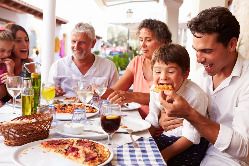 Shared meals are associated with healthier eating and better mood.(Shutterstock)