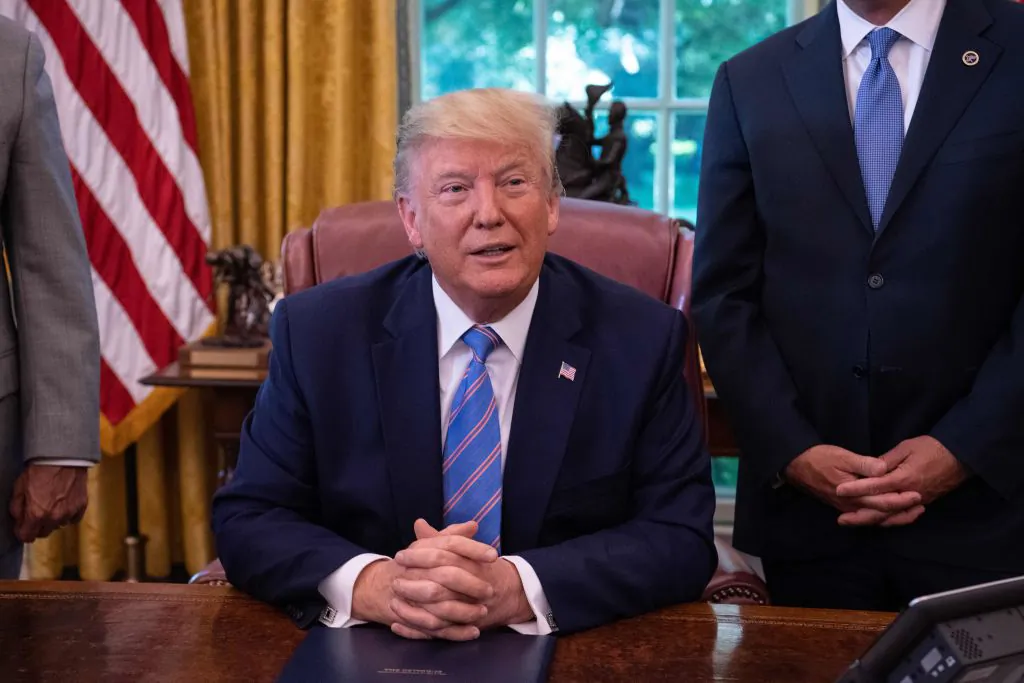 President Donald Trump speaks to the press after signing a bill for border funding legislation in the Oval Office at the White House in Washington, D.C., on July 1, 2019. (NICHOLAS KAMM/AFP)