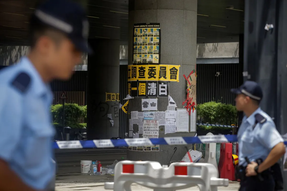 Police survey the damage to the government headquarters in Hong Kong on July 2, 2019. (Vivek Prakash/AFP/Getty Images)
