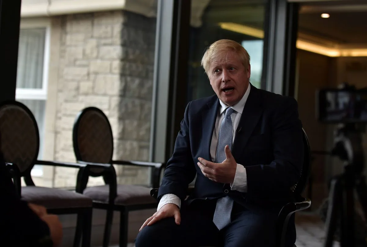Boris Johnson, a leadership candidate for Britain's Conservative Party, gives a television interview before a Hustings event at the Culloden House Hotel in Belfast, Northern Ireland, on July 2, 2019. (Charles McQuillan/Pool via Reuters)