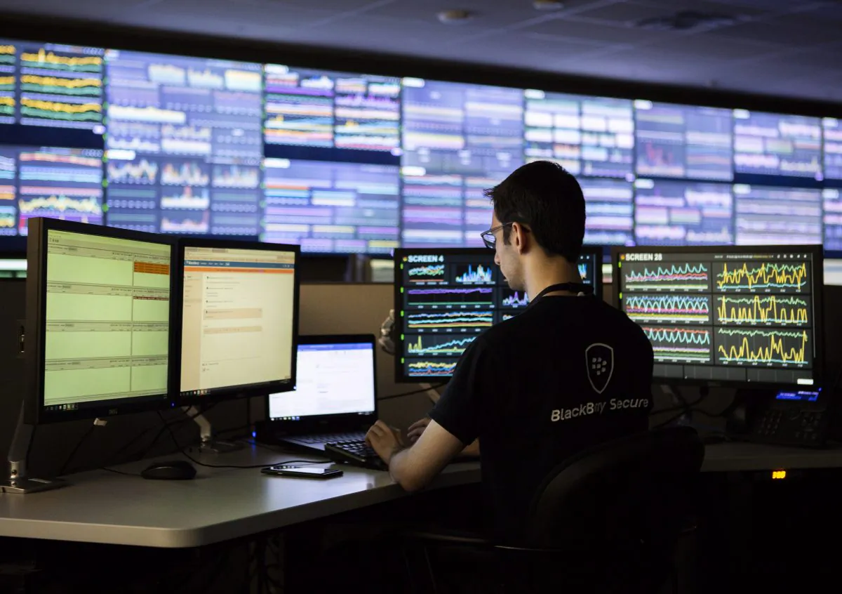 A BlackBerry employee works at the company's Network Operating Centre in Waterloo, Ont., in this file photo. BlackBerry is one Canadian company that grew into serving consumers and businesses globally. (The Canadian Press/Andrew Ryan)