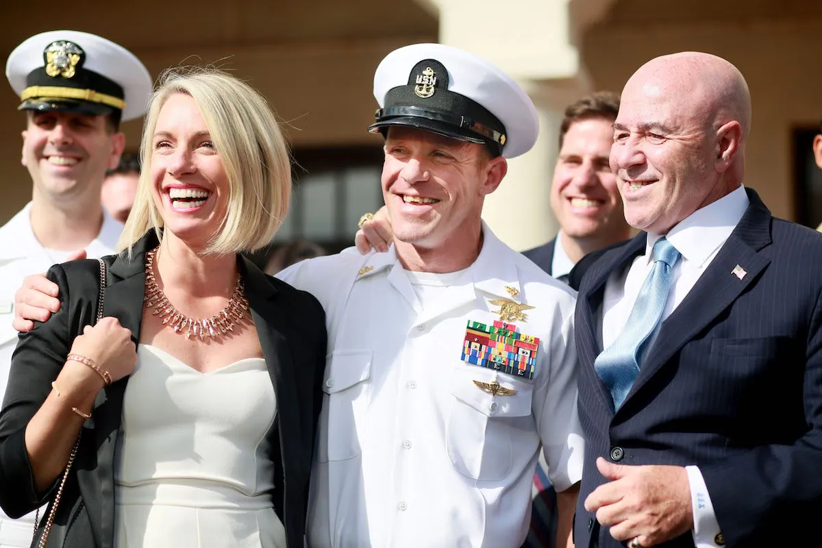 Navy Special Operations Chief Edward Gallagher, center, and his wife Andrea, left, celebrate after being acquitted of all but one charge in San Diego, Calif., on July 2, 2019. (Sandy Huffaker/Getty Images)