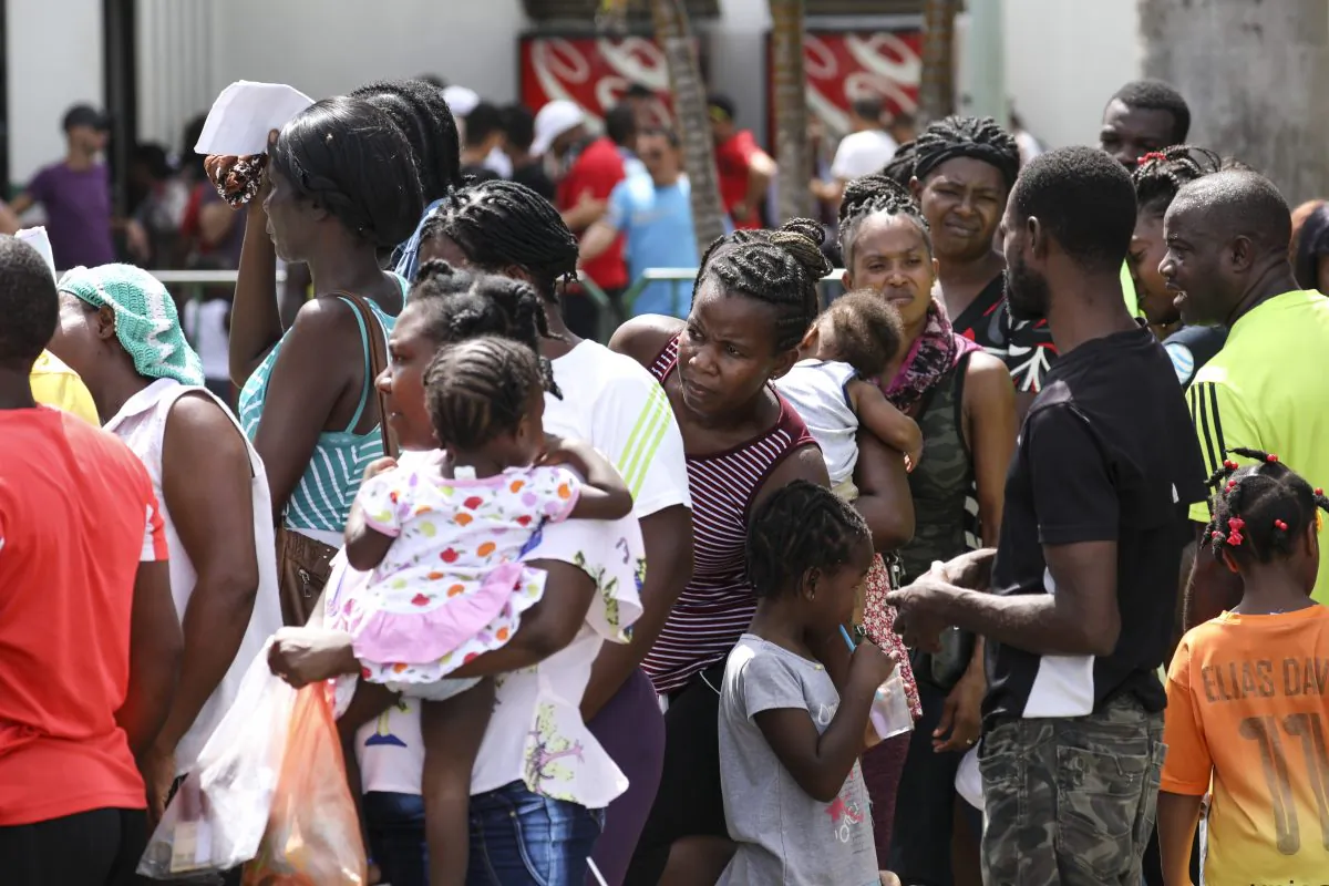 Migrants, mostly from Haiti and Africa, wait for an appointment to obtain legal travel documents at a National Institute of Migration detention centre in Tapachula, Mexico, on June 24, 2019. (Charlotte Cuthbertson/The Epoch Times)