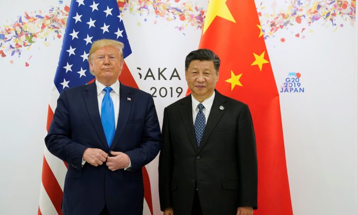 President Donald Trump poses for a photo with Chinese leader Xi Jinping before their bilateral meeting during the G20 leaders summit in Osaka, Japan on June 29, 2019. (Kevin Lamarque/Reuters)