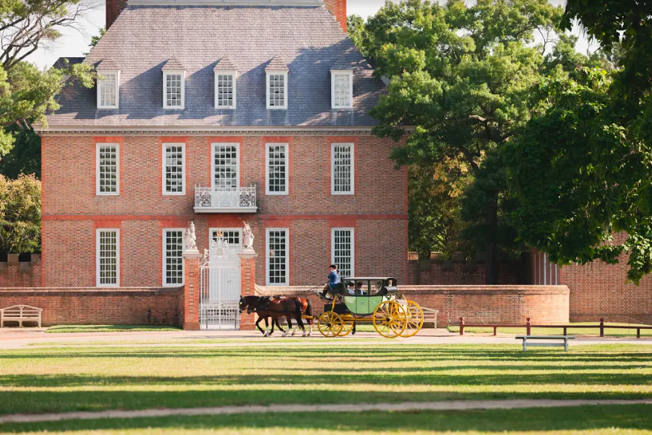 A carriage passes by the Governor's Palace. The palace was built to project British authority. (Colonial Williamsburg Foundation/Colonial Williamsburg)