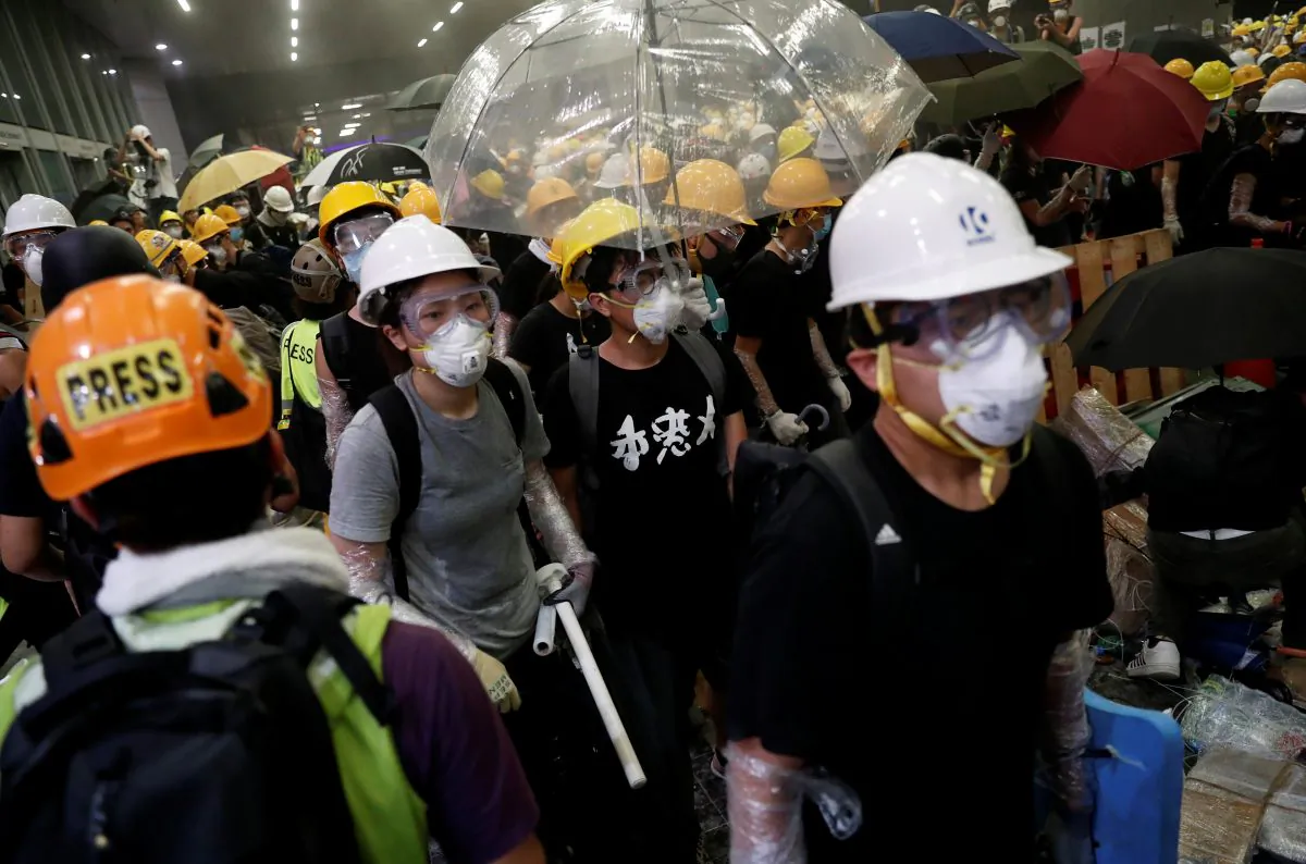 Anti-extradition bill protesters wearing helmets gather outside the Legislative Council building on the anniversary of Hong Kong's handover to China in Hong Kong, China on July 1, 2019. (Tyrone Siu/Reuters)